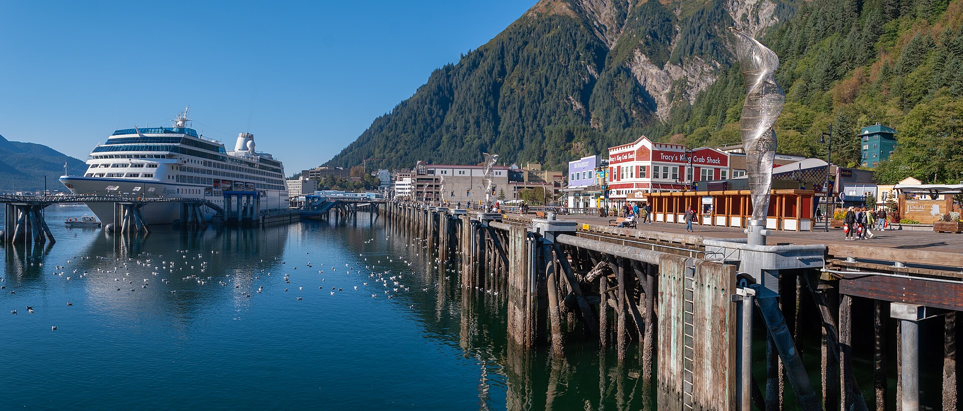 Juneau waterfront beneath forested Alaska mountains